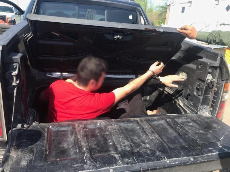 HUMAN SMUGGLERS HIDE ILLEGAL IMMIGRANTS IN BED OF TRUCK
