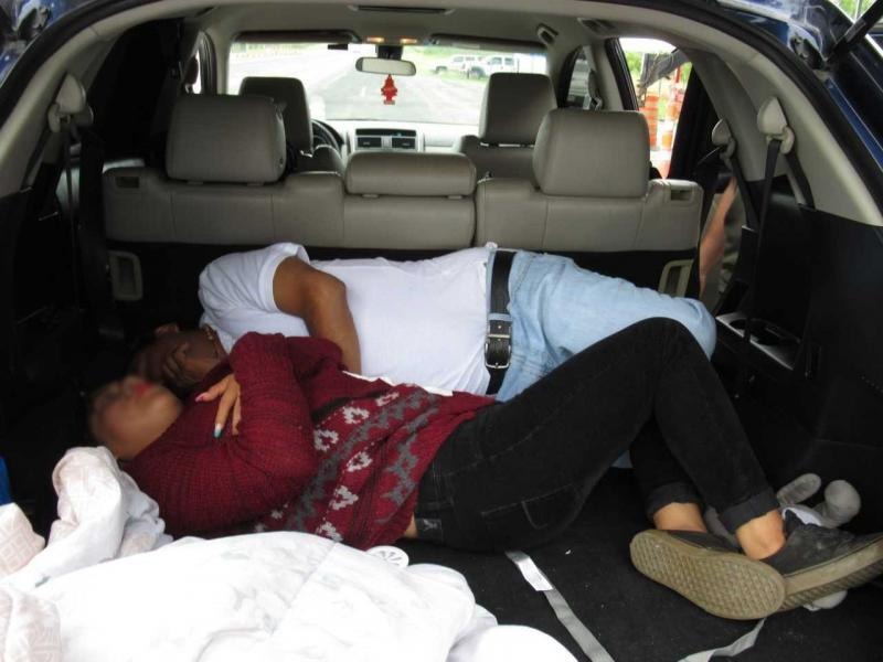 PREGNANT WOMAN SMUGGLED ILLEGAL IMMIGRANTS, WITH 2 OF HER KIDS IN CAR