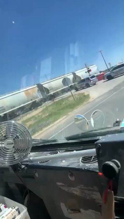 VIDEO: COP CAR GETS HIT BY TRAIN AT RAILROAD CROSSING