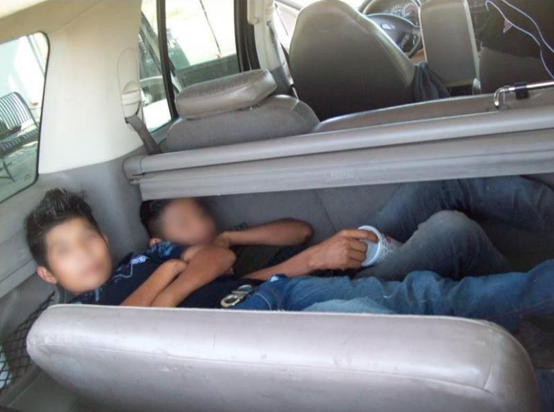WOMAN SMUGGLED ILLEGAL IMMIGRANTS IN TRUNK OF CAR