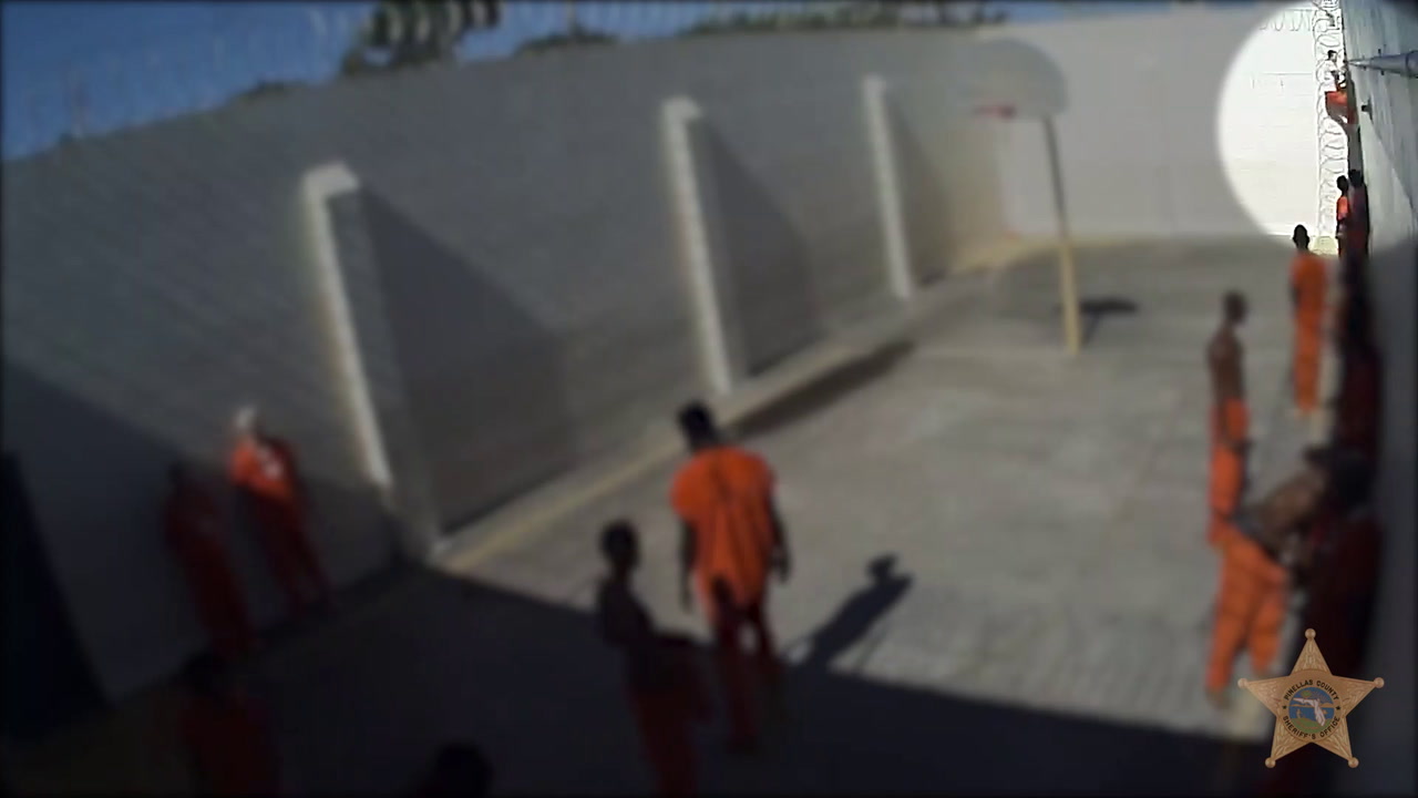 VIDEO: JAIL INMATE ESCAPES BY CLIMBING OVER WALL