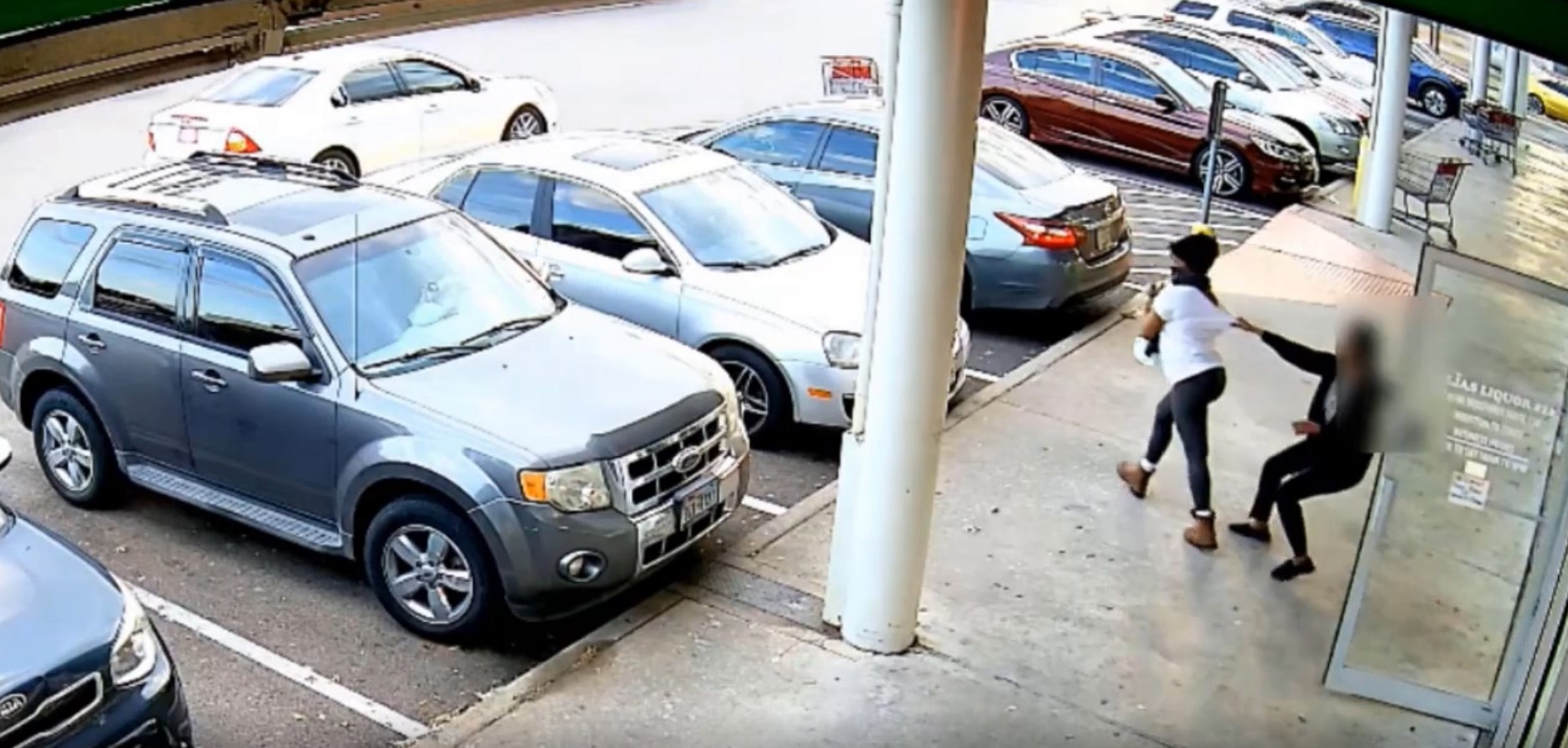 VIDEO: WOMAN STEALS BOTTLES OF PATRON AT LIQUOR STORE, SHIRT RIPPED OFF