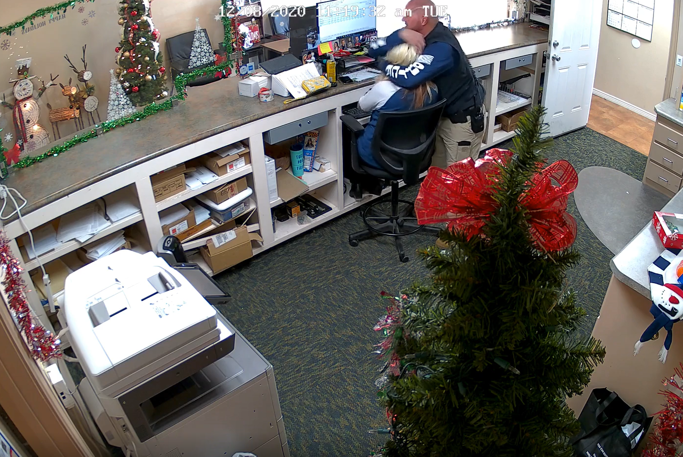 VIDEO: POLICE CHIEF PUTS FEMALE EMPLOYEE IN THE HEAD-LOCK & SWATS BUTT AREA