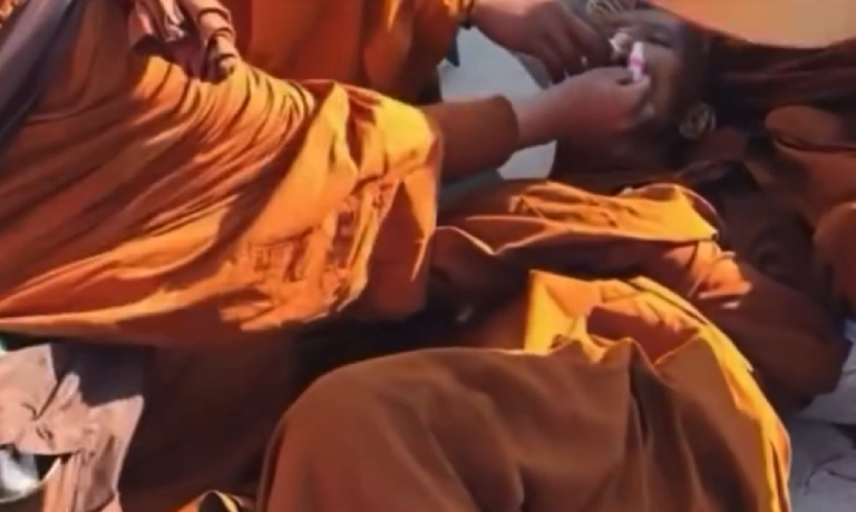 VIDEO MONK PASSES OUT ON WAlk TO CHARLOTTE, WALKING AIMLESSLY ACROSS USA