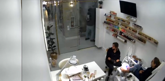 video man shoots girlfriend at nail salon